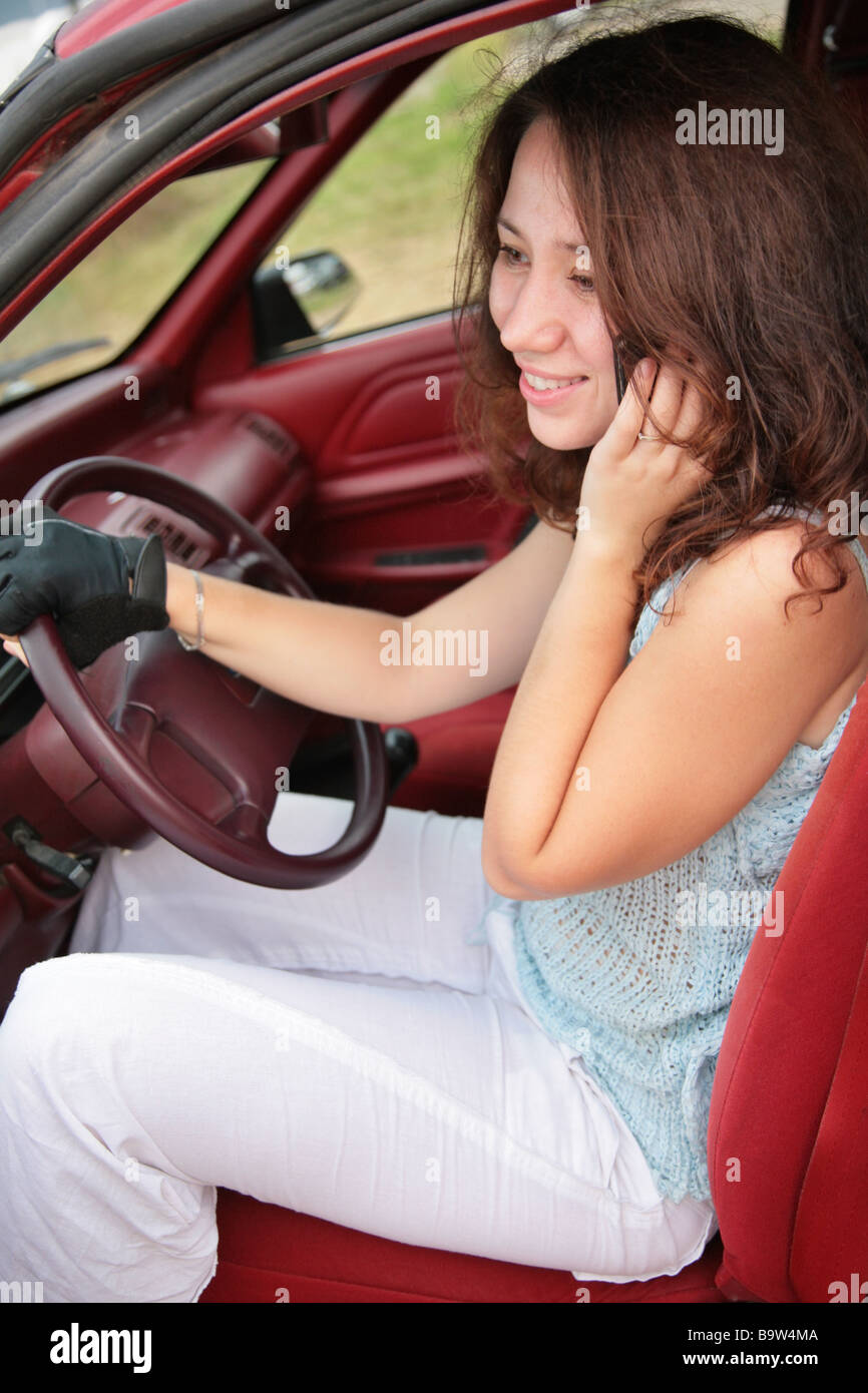 woman with phone in car Stock Photo Alamy