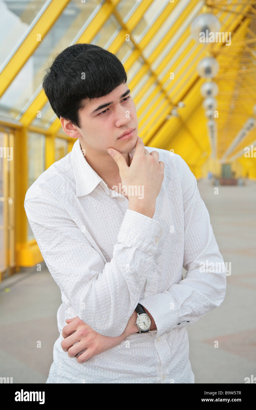 pensive young man on footbridge Stock Photo - Alamy