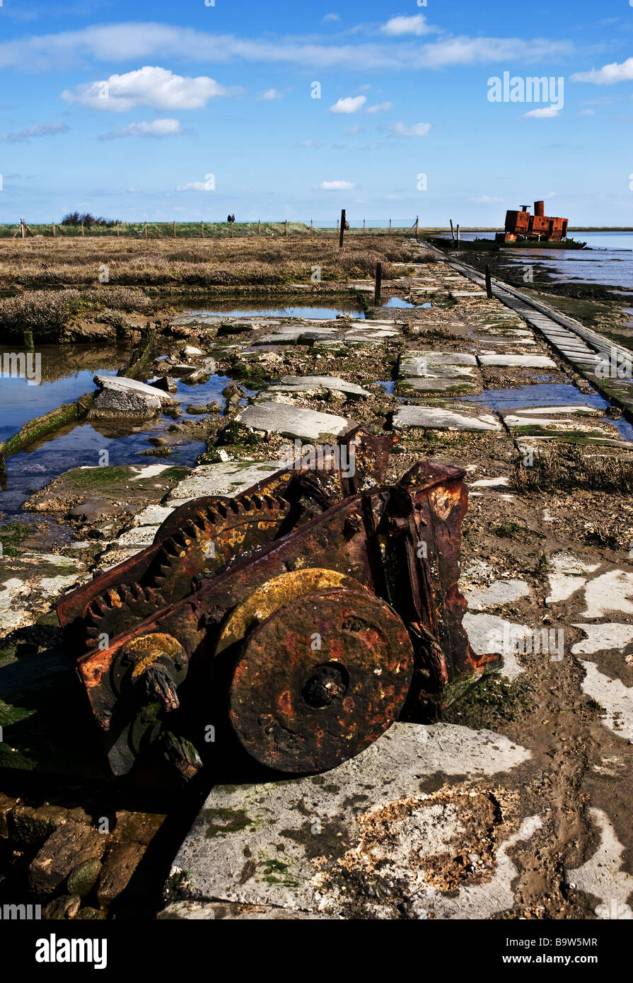 Old machinery dumped on the banks of the River Roach near Paglesham in