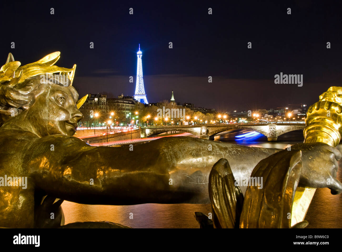 View of the Eiffel Tower at night from the Alexandre III bridge, Paris, France, Europe Stock Photo