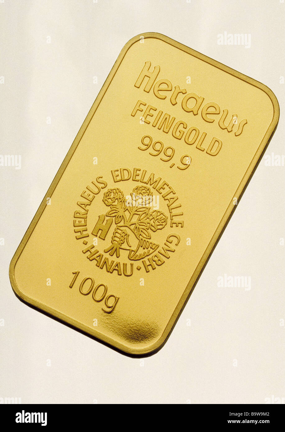 hundred nine gold bar procurement precious metal pure gold bar company name cut out investmentsembossed gold ingot golden Stock Photo