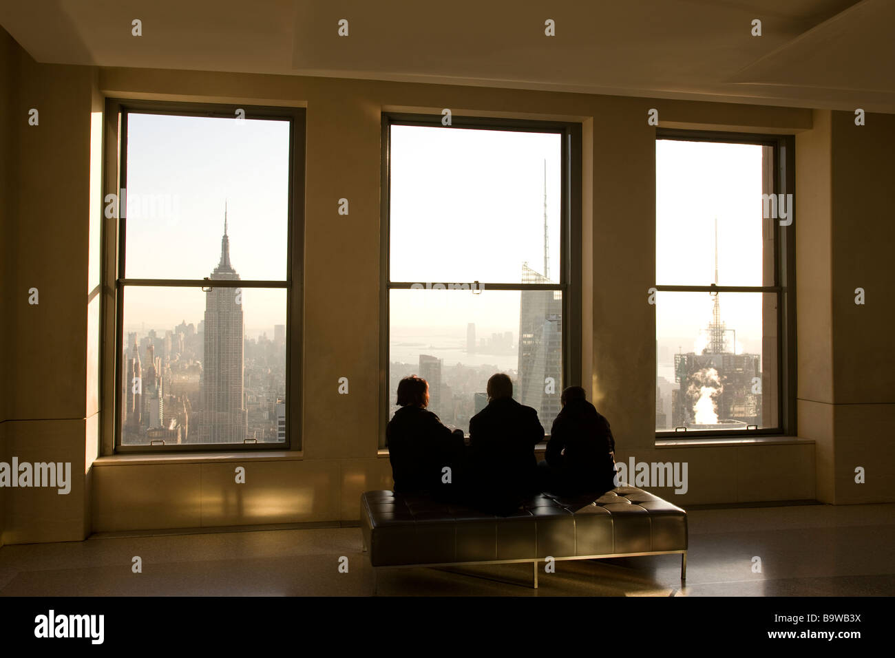 MIDTOWN SKYLINE VIEW  THROUGH WINDOWS OF ROCKEFELLER CENTER MANHATTAN NEW YORK CITY USA Stock Photo