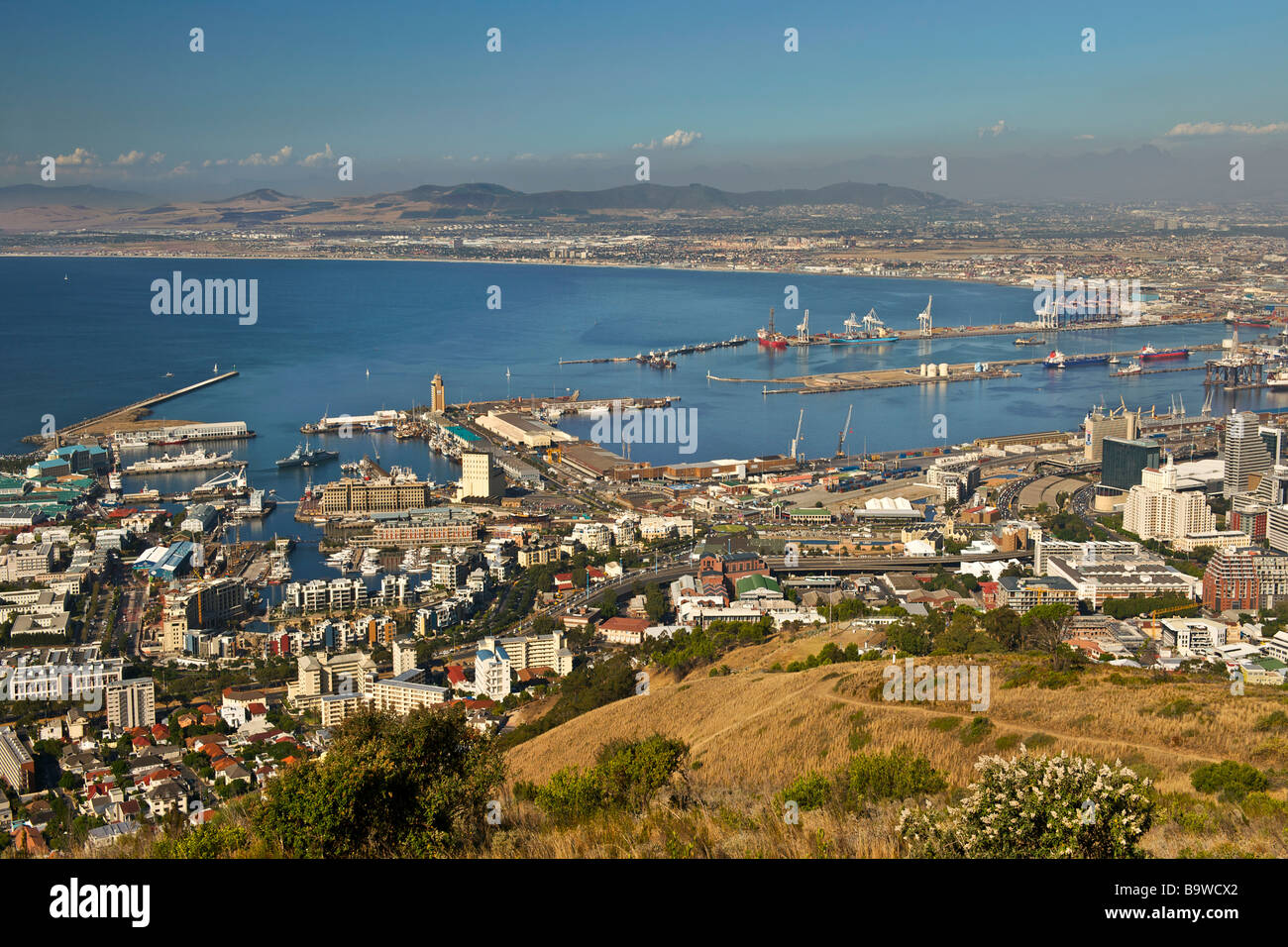 View of Table Bay and the Cape Town harbour and waterfront seen from Signal Hill. Stock Photo