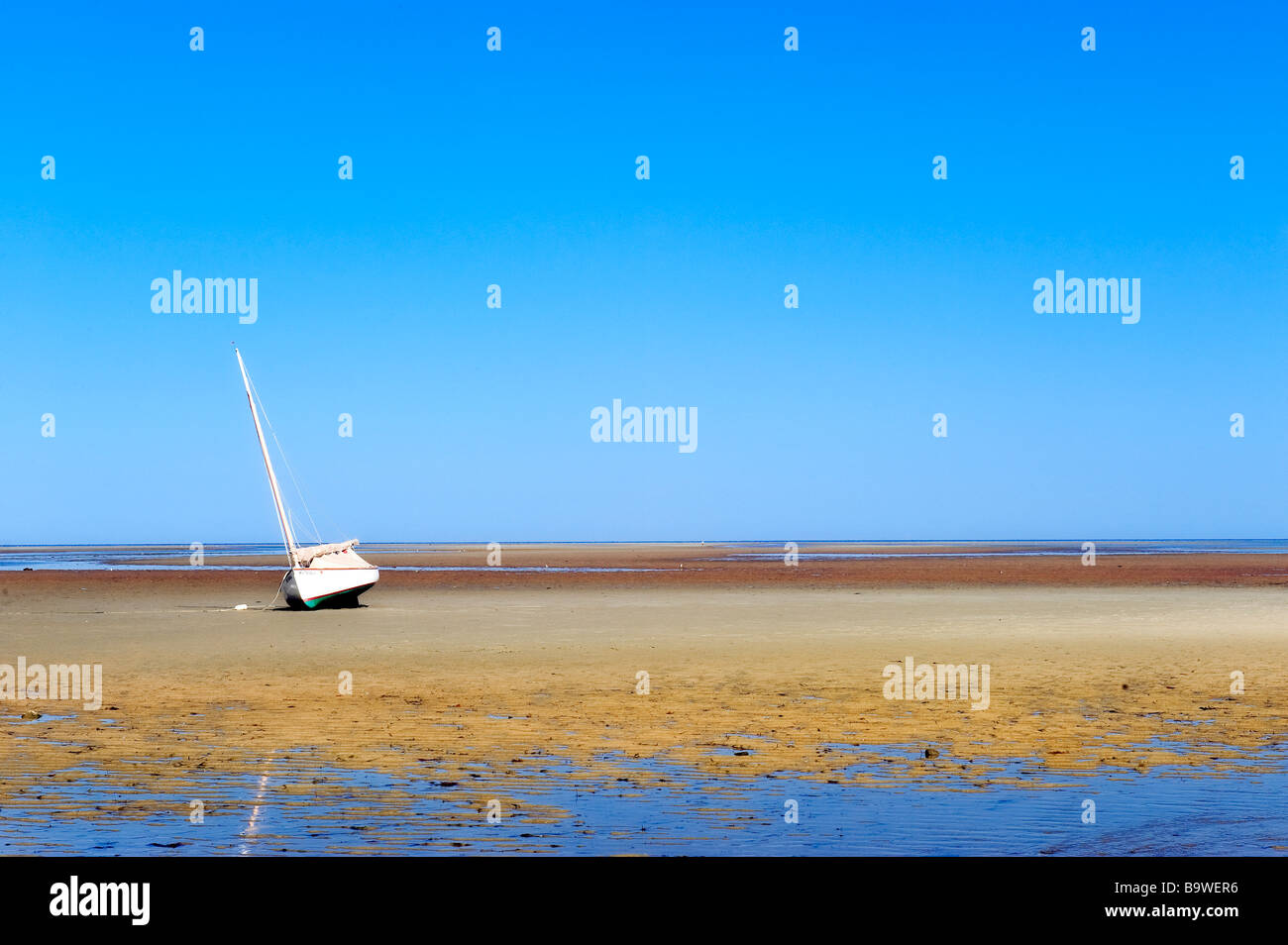 Sailboat on a tidal flat Brewster Cape Cod MA USA Stock Photo