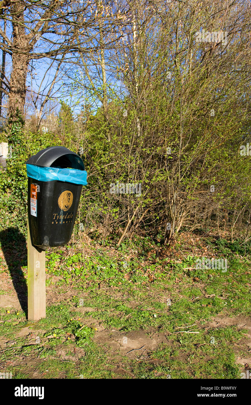 Waste bin on river bank footpath at Corbridge Northumberland marked