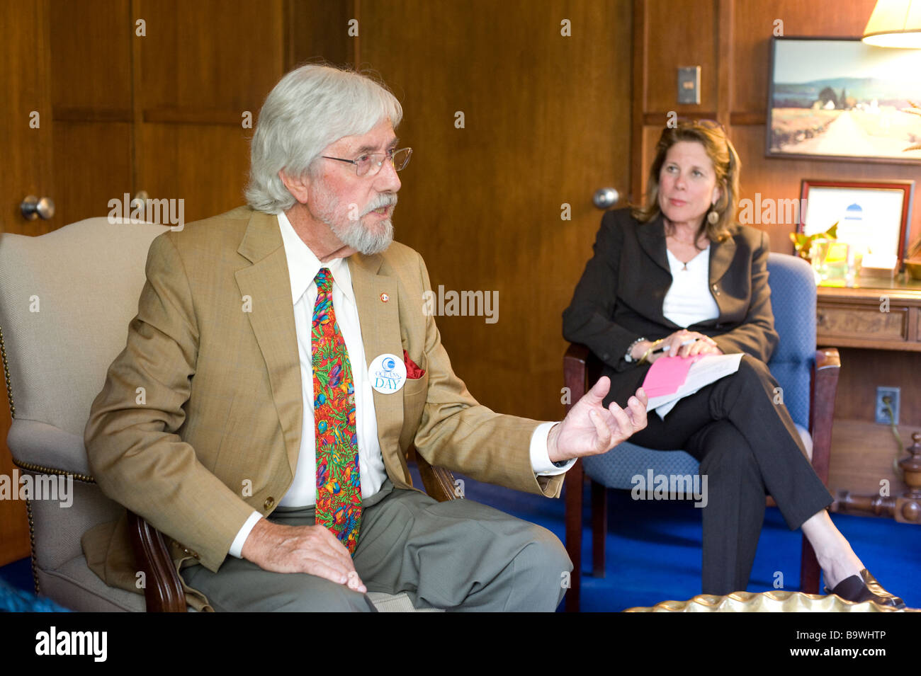 Jean-Michel Cousteau speaks with the Lieutenant Governor of California in the California state capitol building Stock Photo