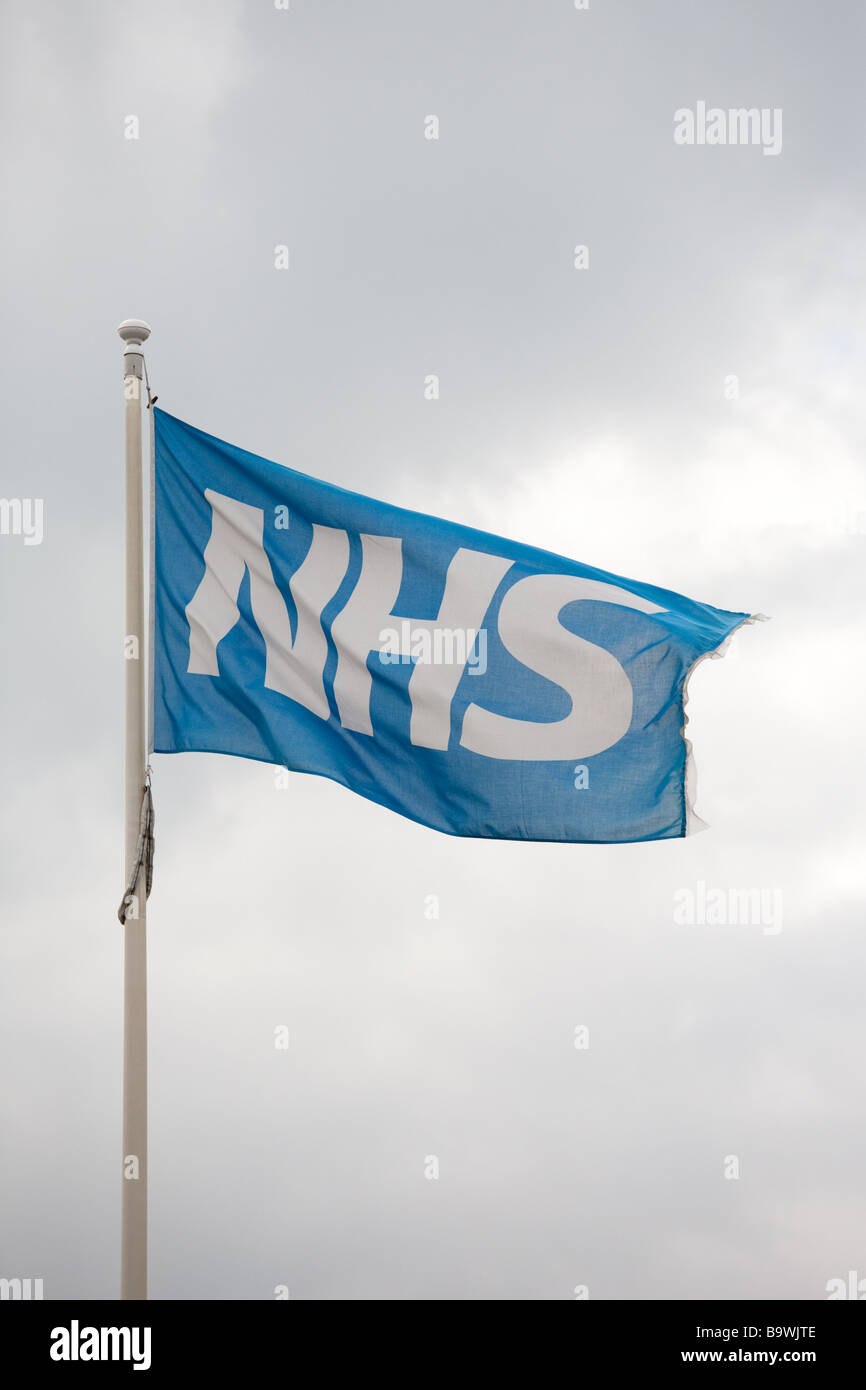 Flag of the National Health Service (NHS) flying outside a UK hospital Stock Photo