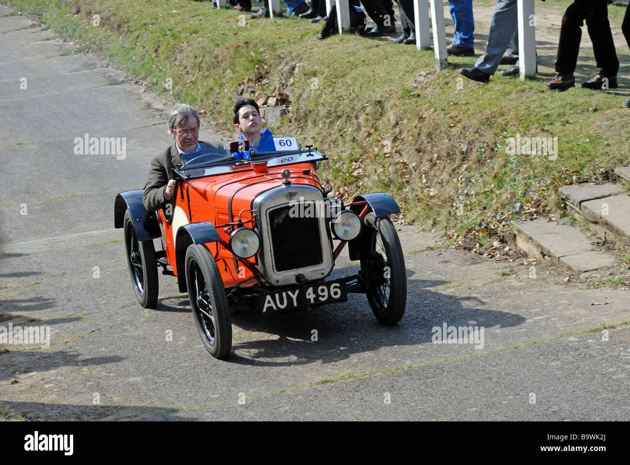 AUY 496 a 1931 Austin Ulster ex works TT David Howe ascending at speed on the Brooklands Museum Test Hill Challenge celebrating Stock Photo