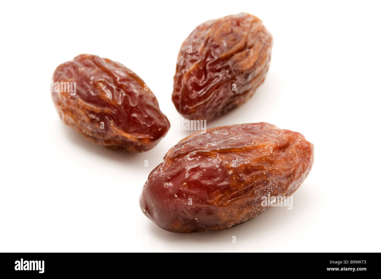 Dried Medjool dates on a white background Stock Photo Alamy