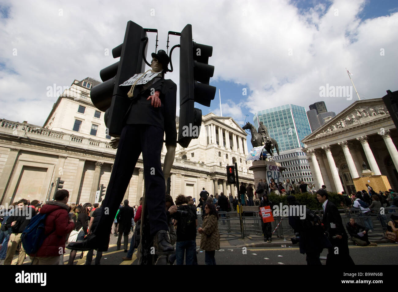 G20 demonstration London mock hanging of a banker from traffic light with eat the bankers sign bank of england Stock Photo
