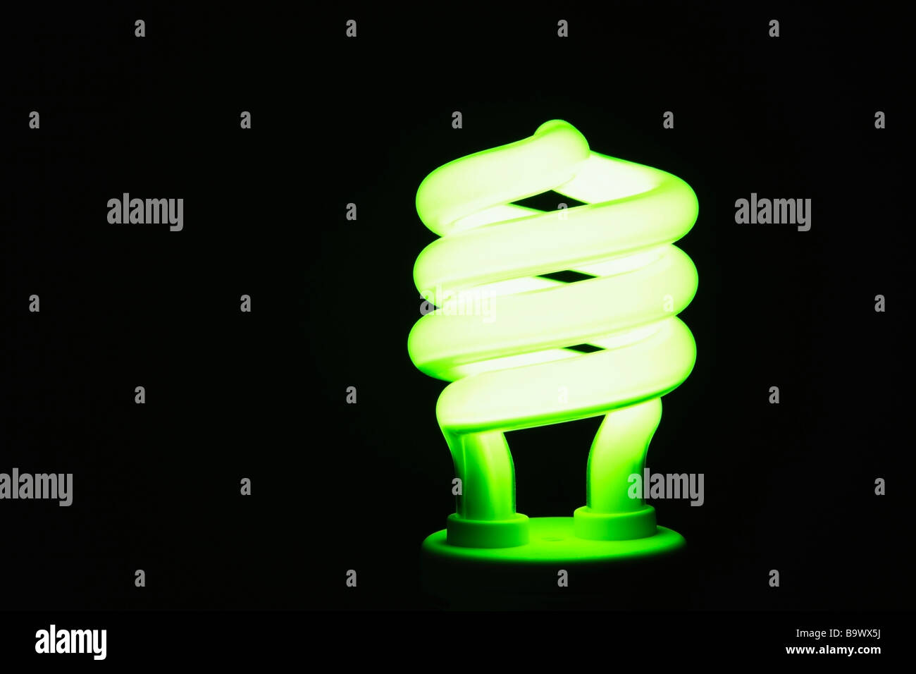 Energy saving lightbulb lighting up Stock Photo