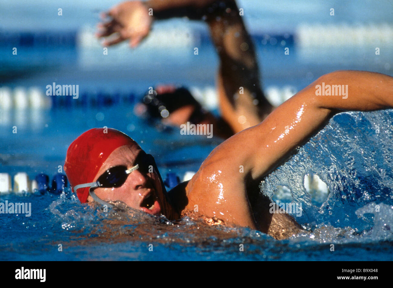 Swimmers competing in a race Stock Photo
