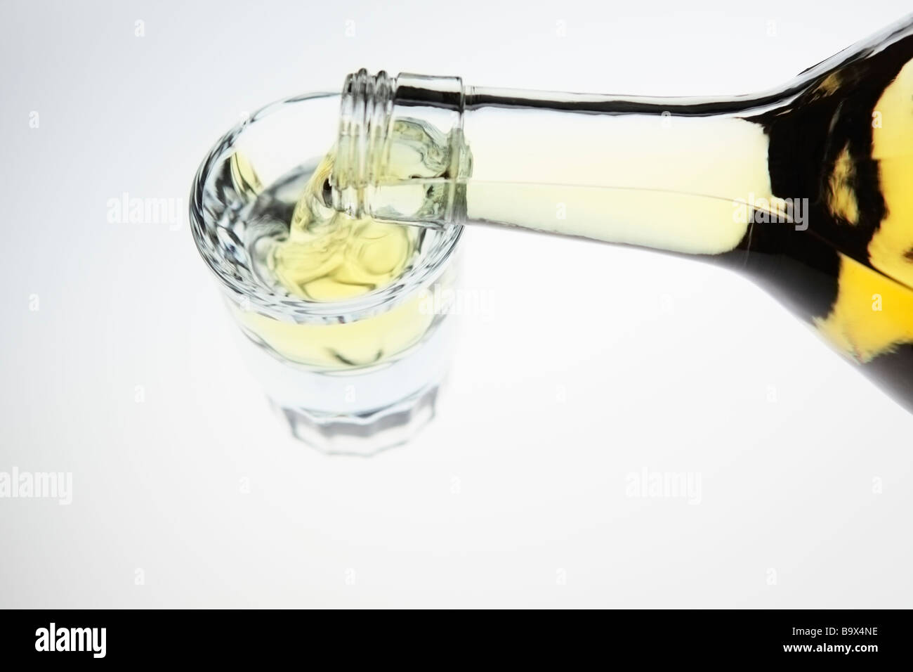 Liquor poured into a shot glass Stock Photo