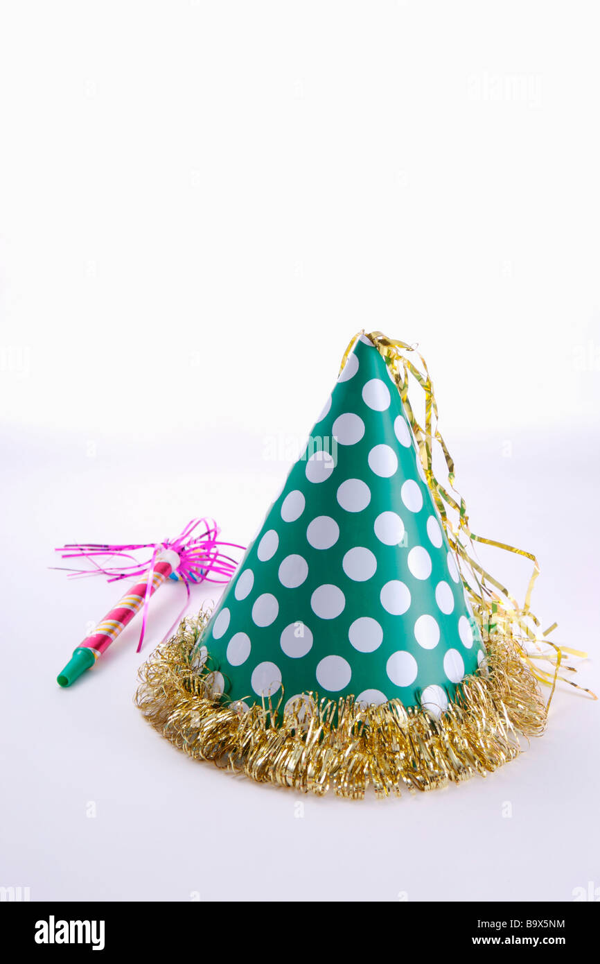 Party hat and party horn blower Stock Photo - Alamy