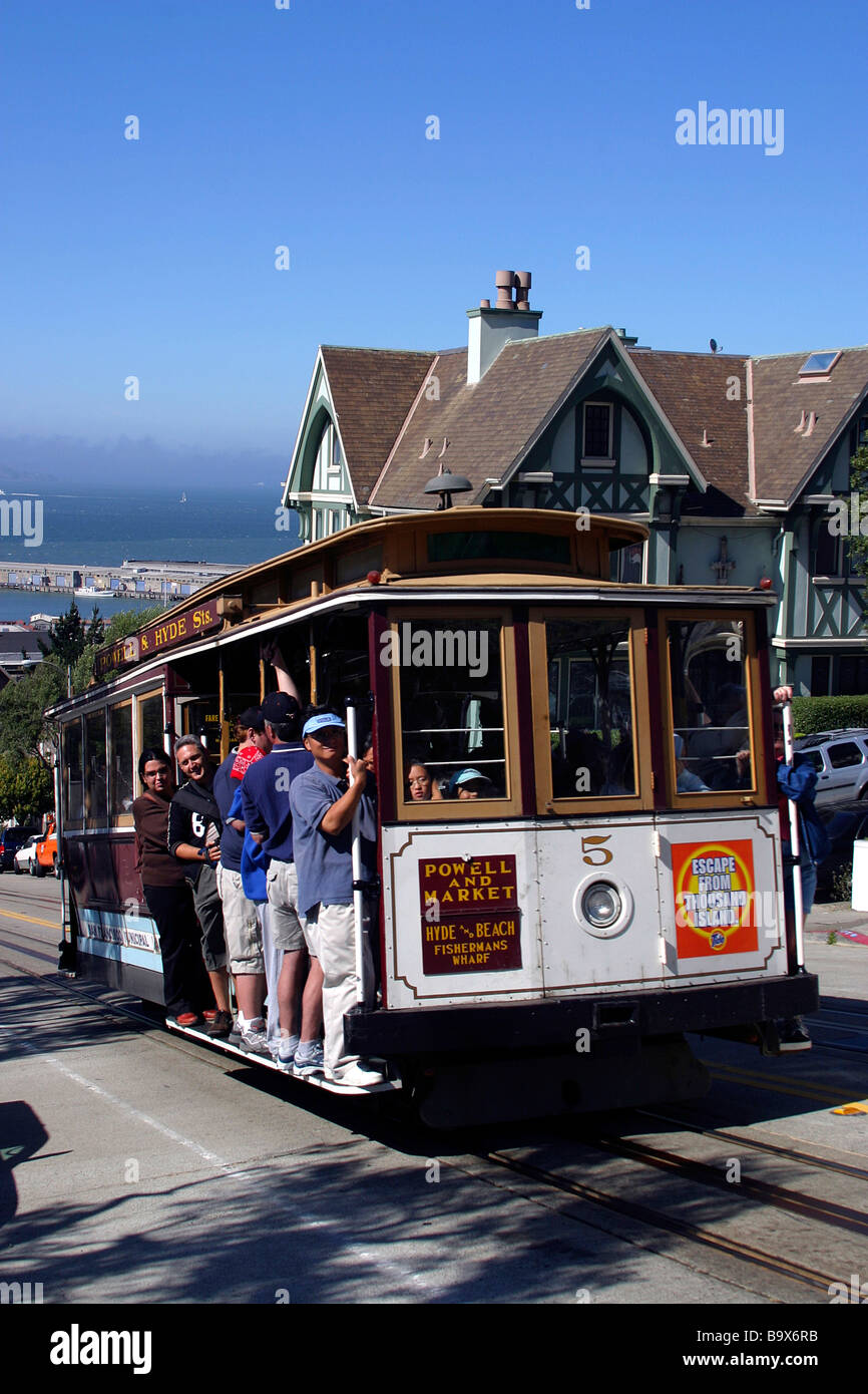Visitors ride up the Powell Hyde cable car line from Fisherman s wharf