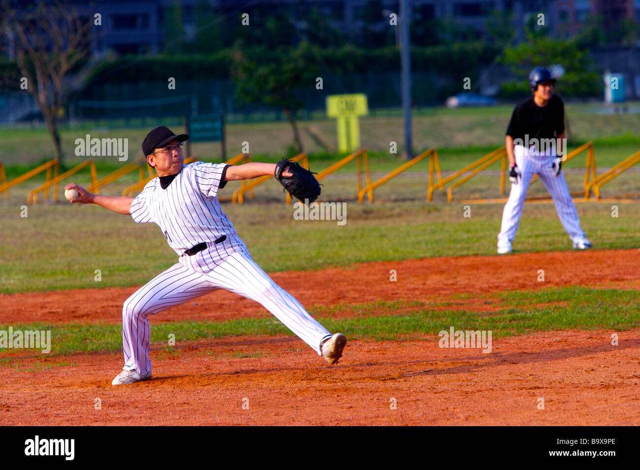 Baseball pithcer preparing to throw ball Stock Photo Alamy