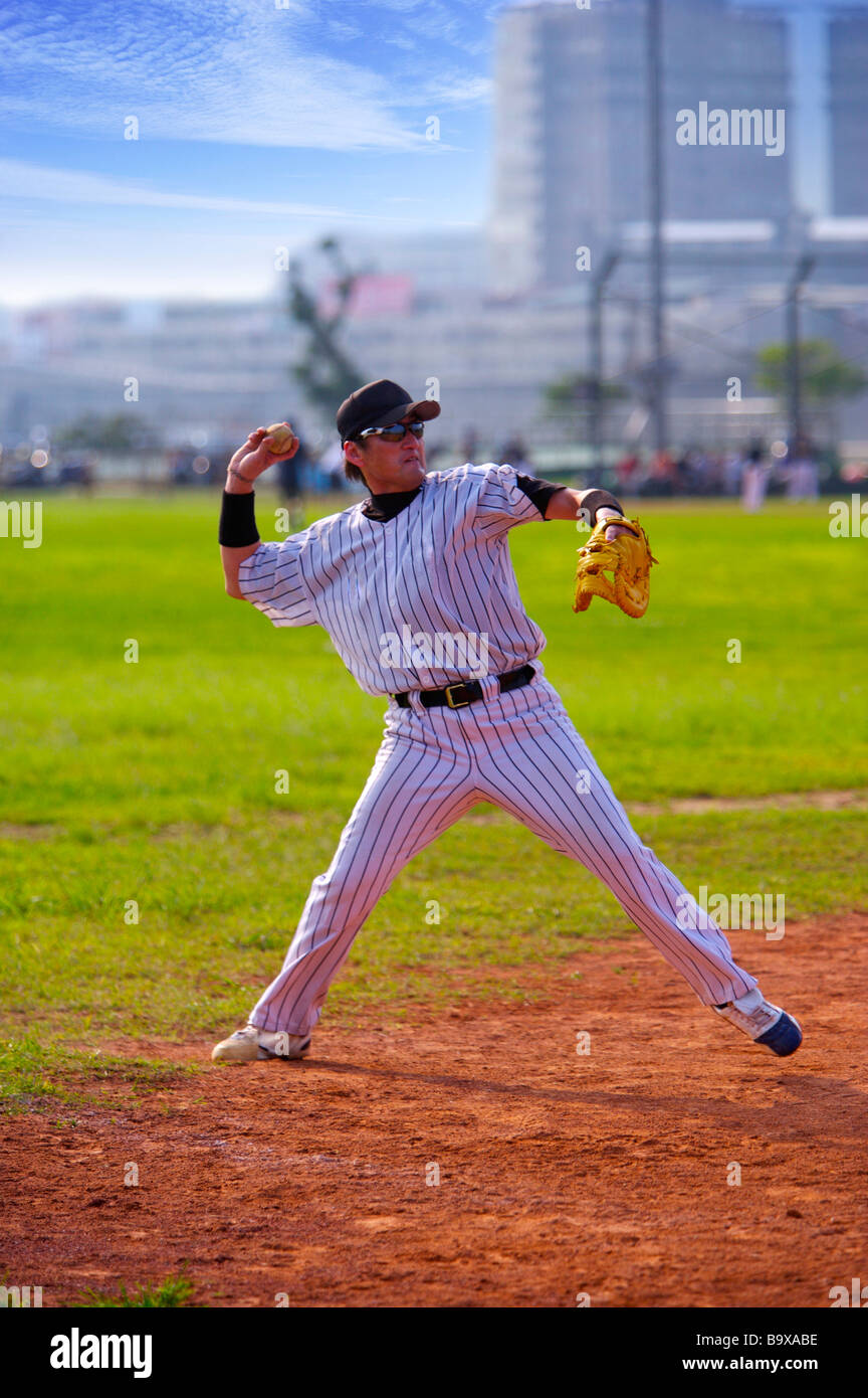 Baseball pitcher preparing to throw ball Stock Photo Alamy