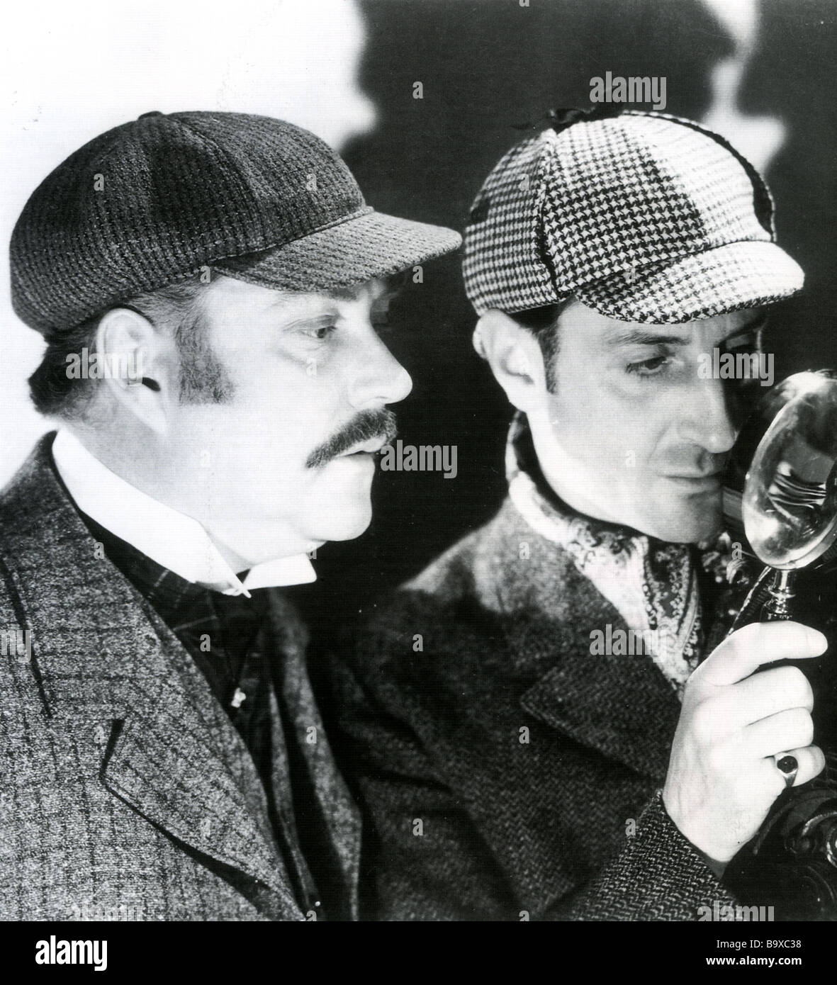 SHERLOCK HOLMES Nigel Bruce at left as Dr Watson and Basil Rathbone as Holmes Stock Photo