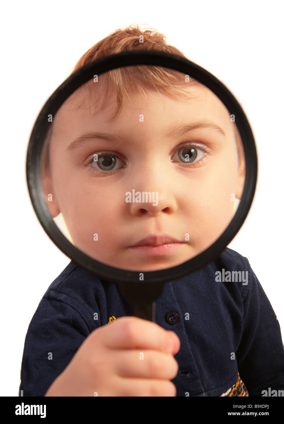 Child look through magnifier Stock Photo Alamy