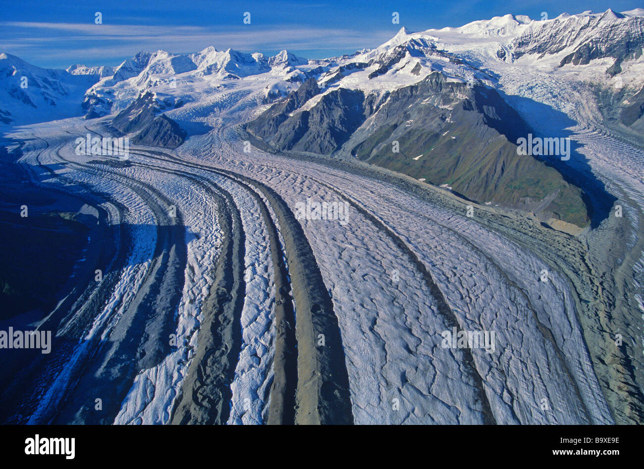 Aerial View of Kenicott Glacier With Medial Moraines flowing from Wrangell Mountains in Wrangell St Elias National Park Alaska Stock Photo