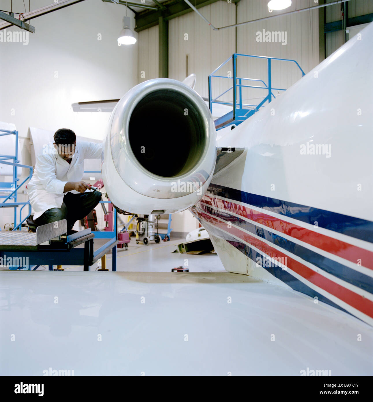 An aeronautical engineer applies scientific and technological principles to research, design, maintain, test and development Stock Photo