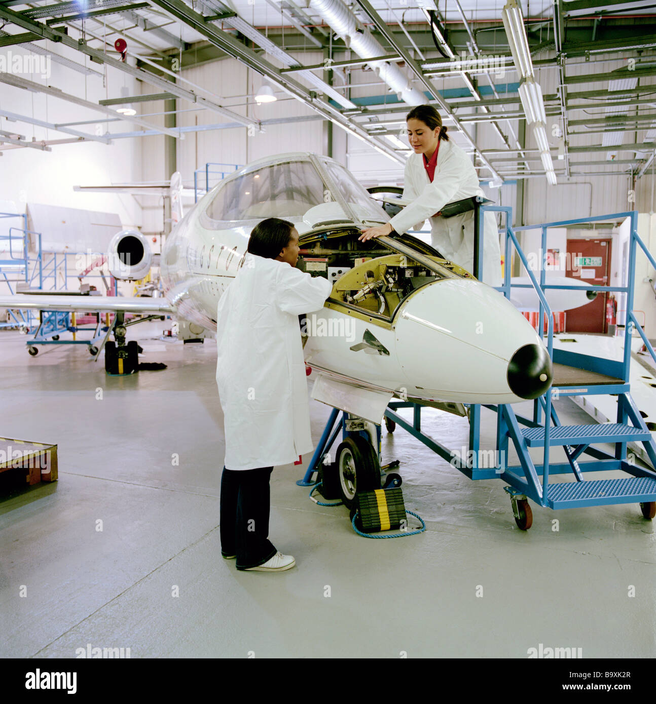 An aeronautical engineer applies scientific and technological principles to research, design, maintain, test and development Stock Photo