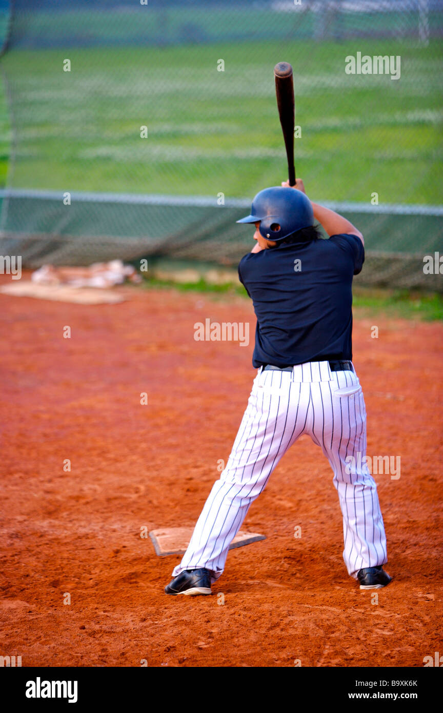 Baseball player swinging bat Stock Photo Alamy