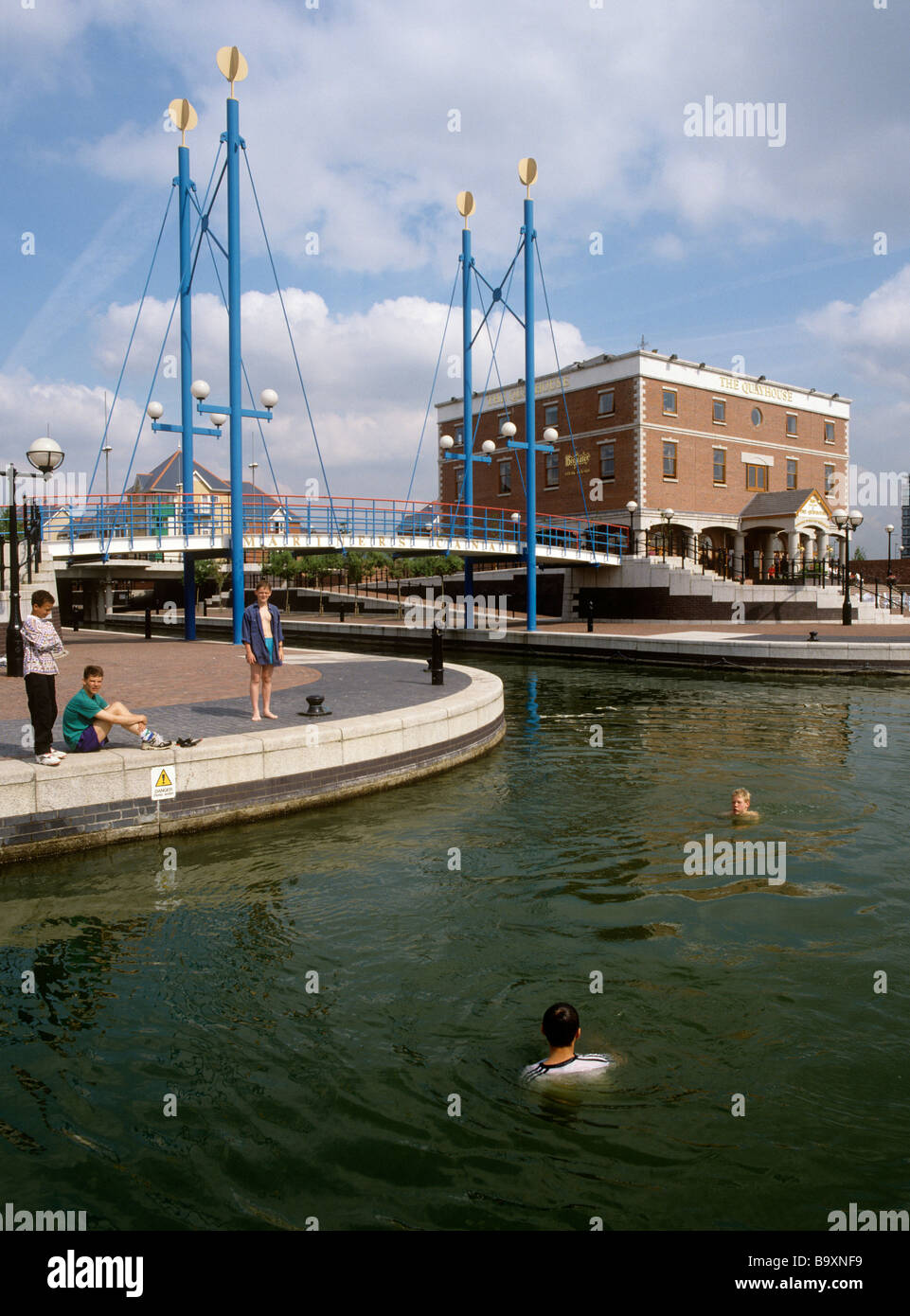 UK England Salford Quays boys swimming in Manchester Ship Canal Stock