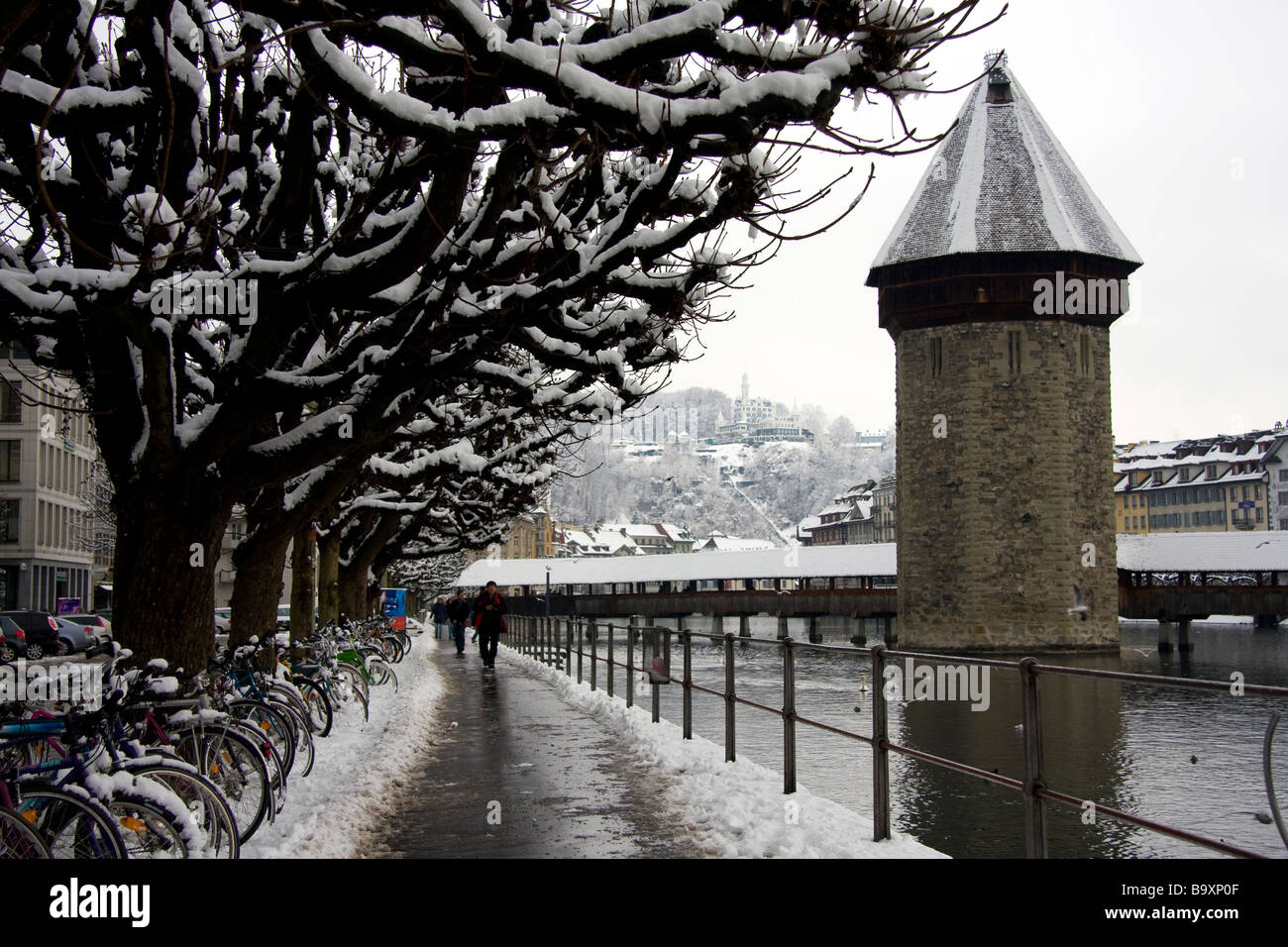 The Kapellbrücke Chapel Bridge covered in snow crosses the Reuss River near Lucerne in Switzerland Stock Photo