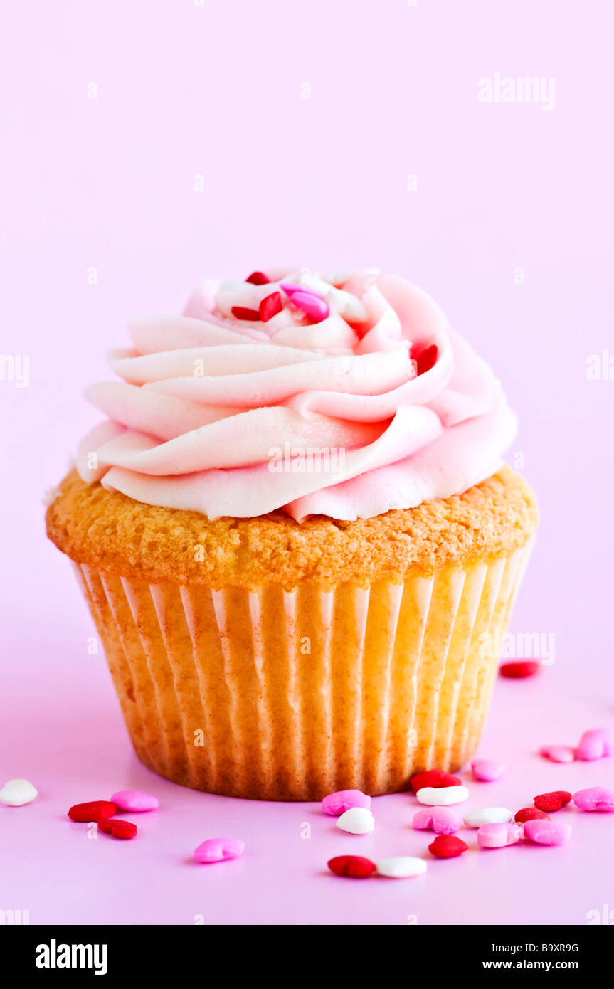 Single cupcake with pink icing and sprinkles Stock Photo Alamy