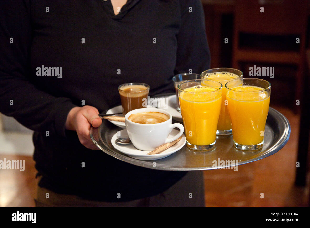 Tray of Morning Beverages Coffees and Orange Juice in Granada Spain