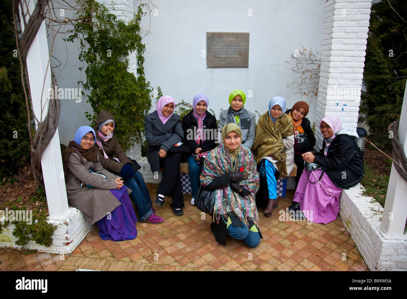 Muslim Malaysian Women Tourists at the Great Mosque in Granada Spain Stock Photo