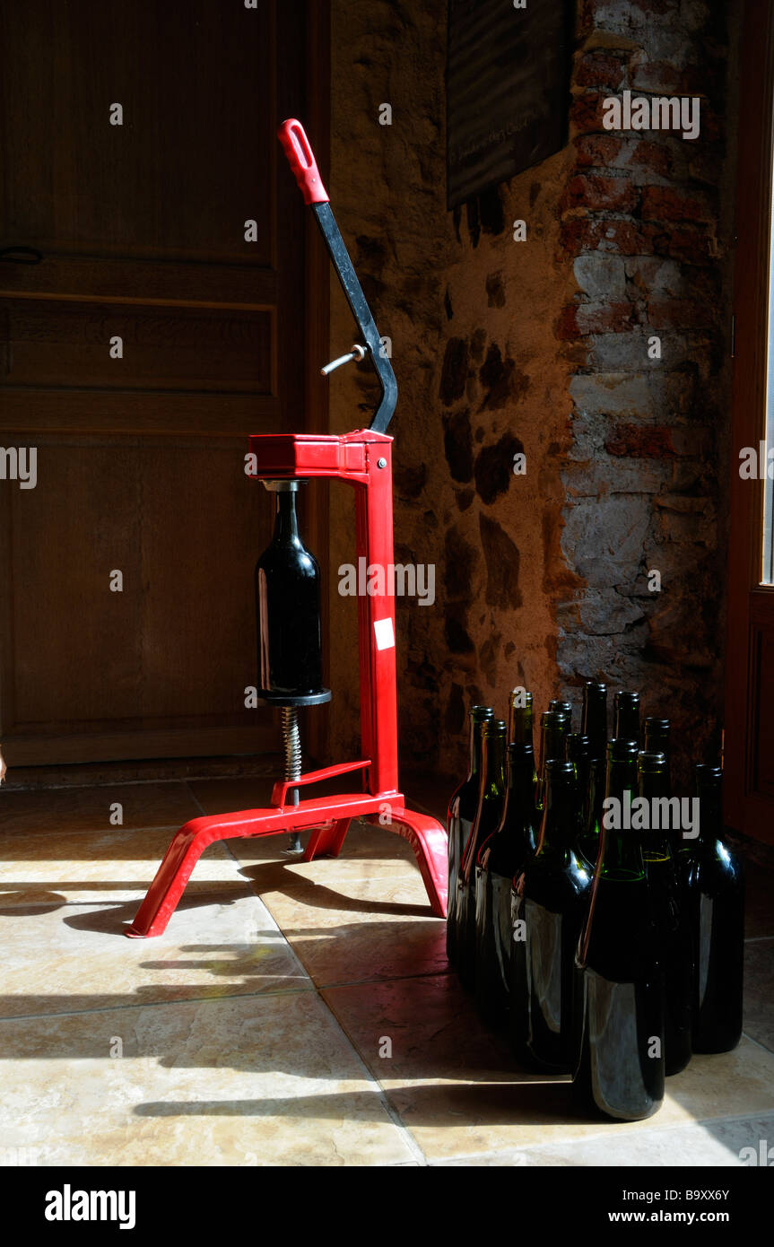 Stock photo of a floor standing wine corking machine standing next to