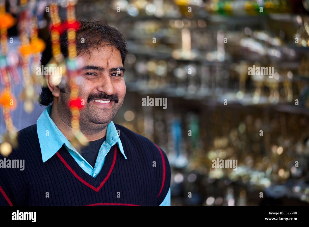 Vendor at a Souvenir Shop Selling Statues in Delhi India Stock Photo