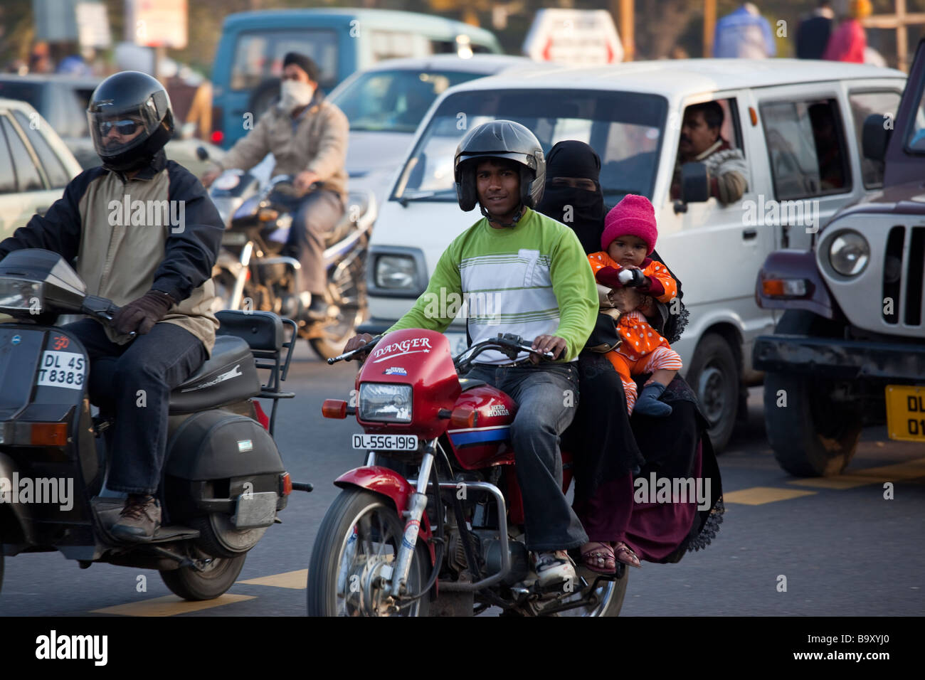 Muslim Family on a Motorcycle in New Delhi India Stock Photo - Alamy