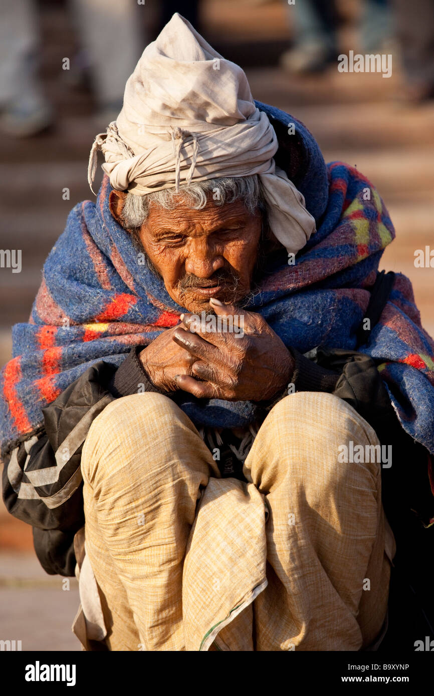 Homeless Man Smoking in Delhi India Stock Photo - Alamy