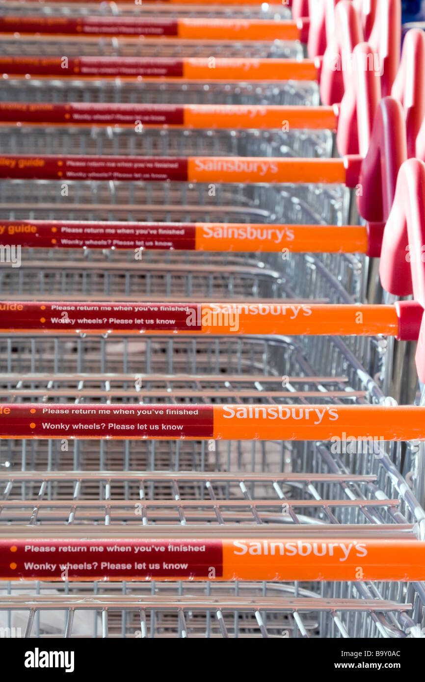 A row of Sainsbury's supermarket trolleys Stock Photo