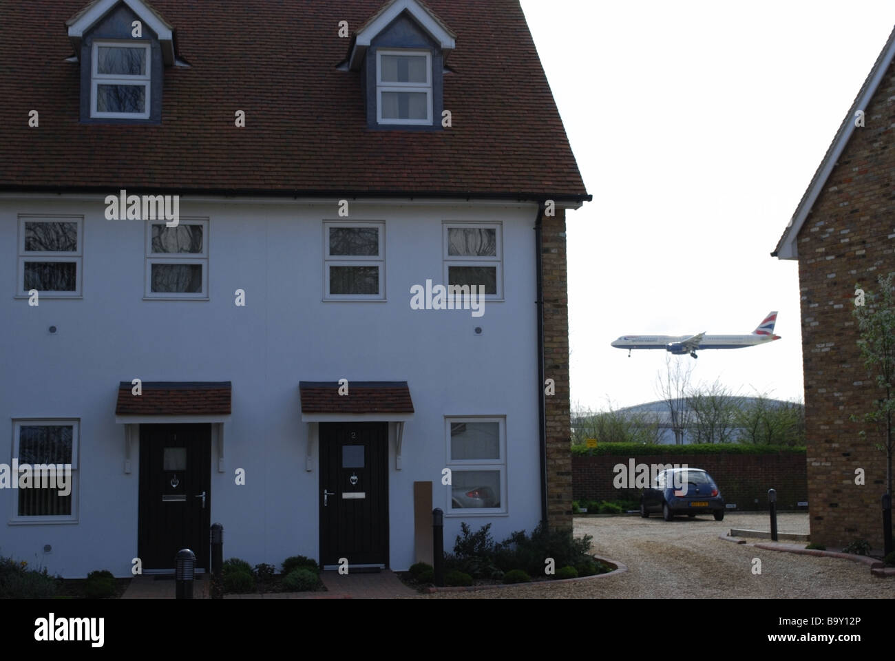 Airplane landing at Heathrow Airport Stock Photo