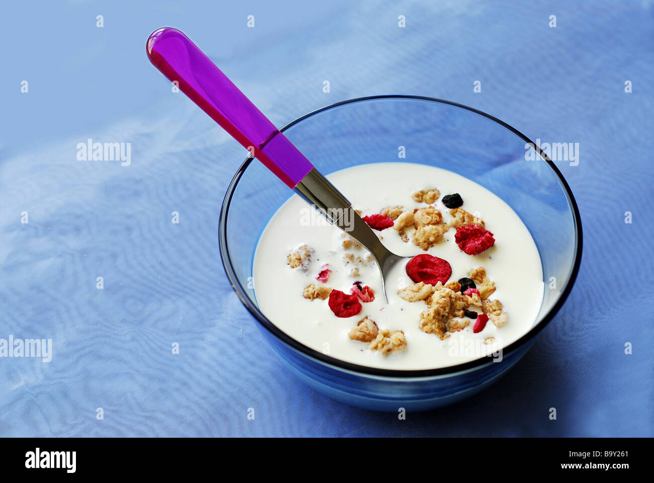 Breakfast cereal in a bowl with a spoon Stock Photo - Alamy