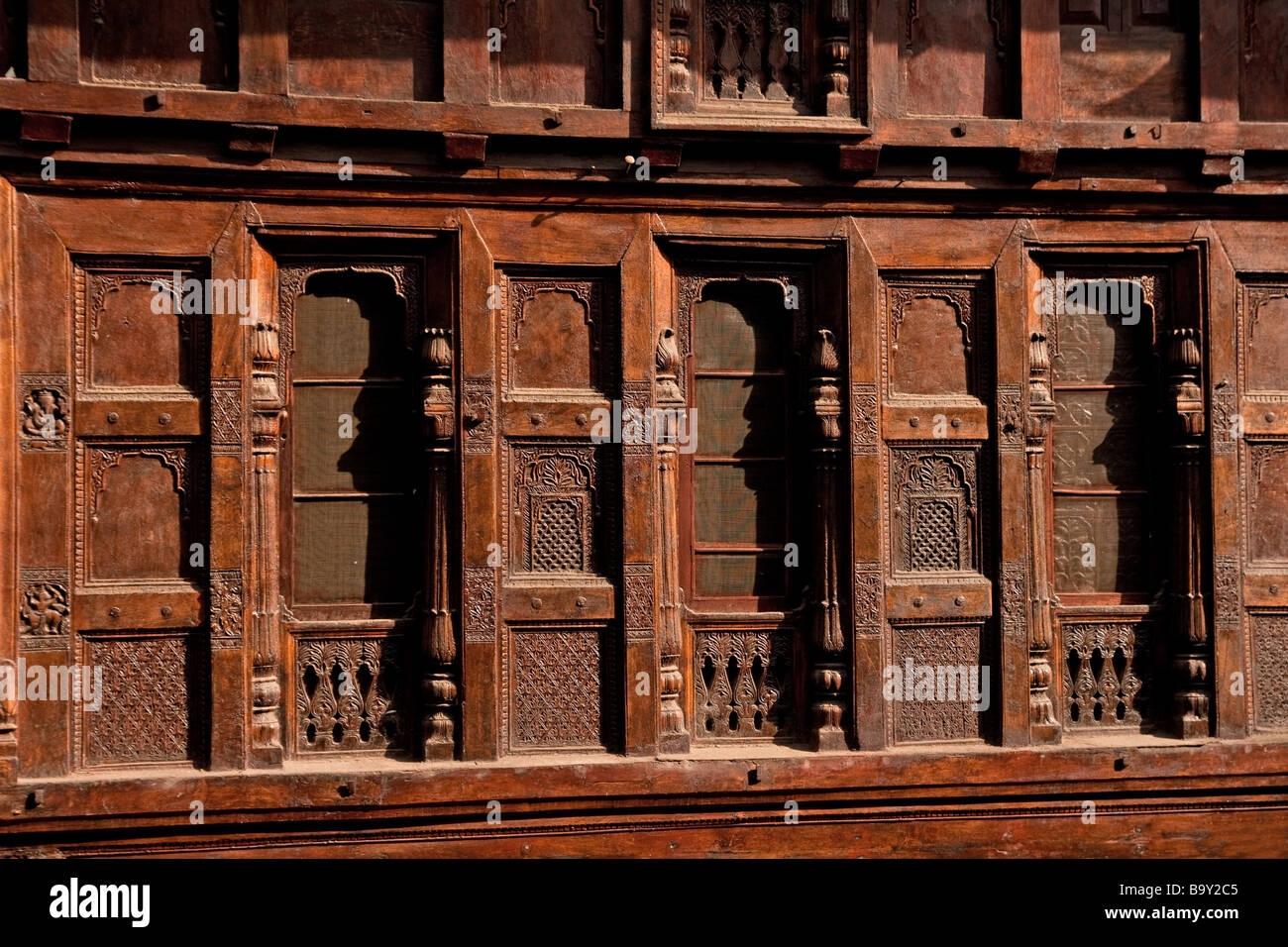 Beautiful and ornately carved woodwork of the rapidly dissapearing old houses in Almora's main bazaar, Uttaranchal, India Stock Photo