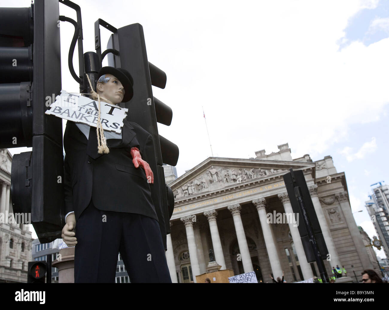 A manakin of a Banker is strung up on a traffic light in front of the Bank Of England. Stock Photo