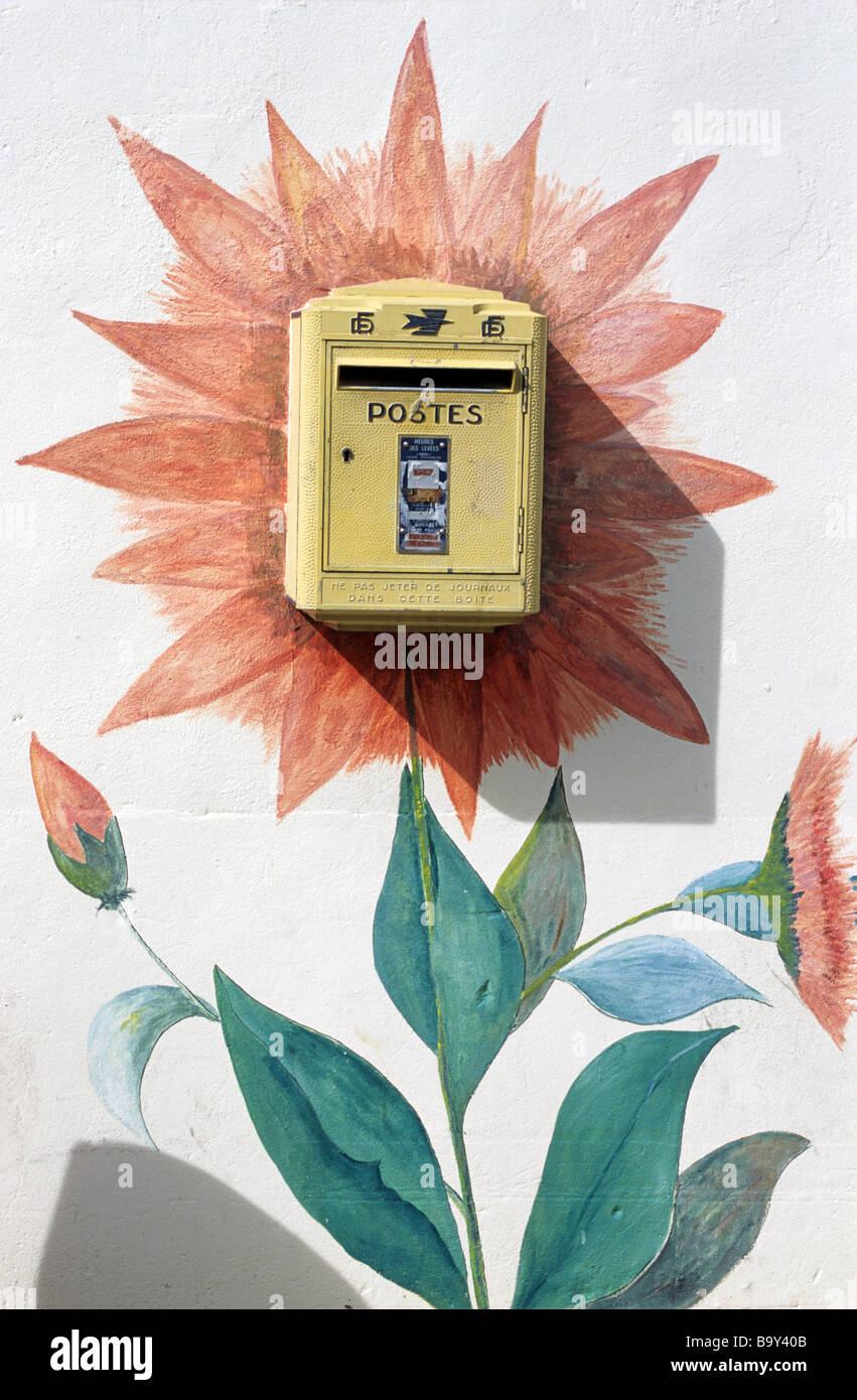 Decorative French Yellow Post, Letter or Mail Box & Mural or Wall Painting of Sunflower, Istres, Provence, France Stock Photo