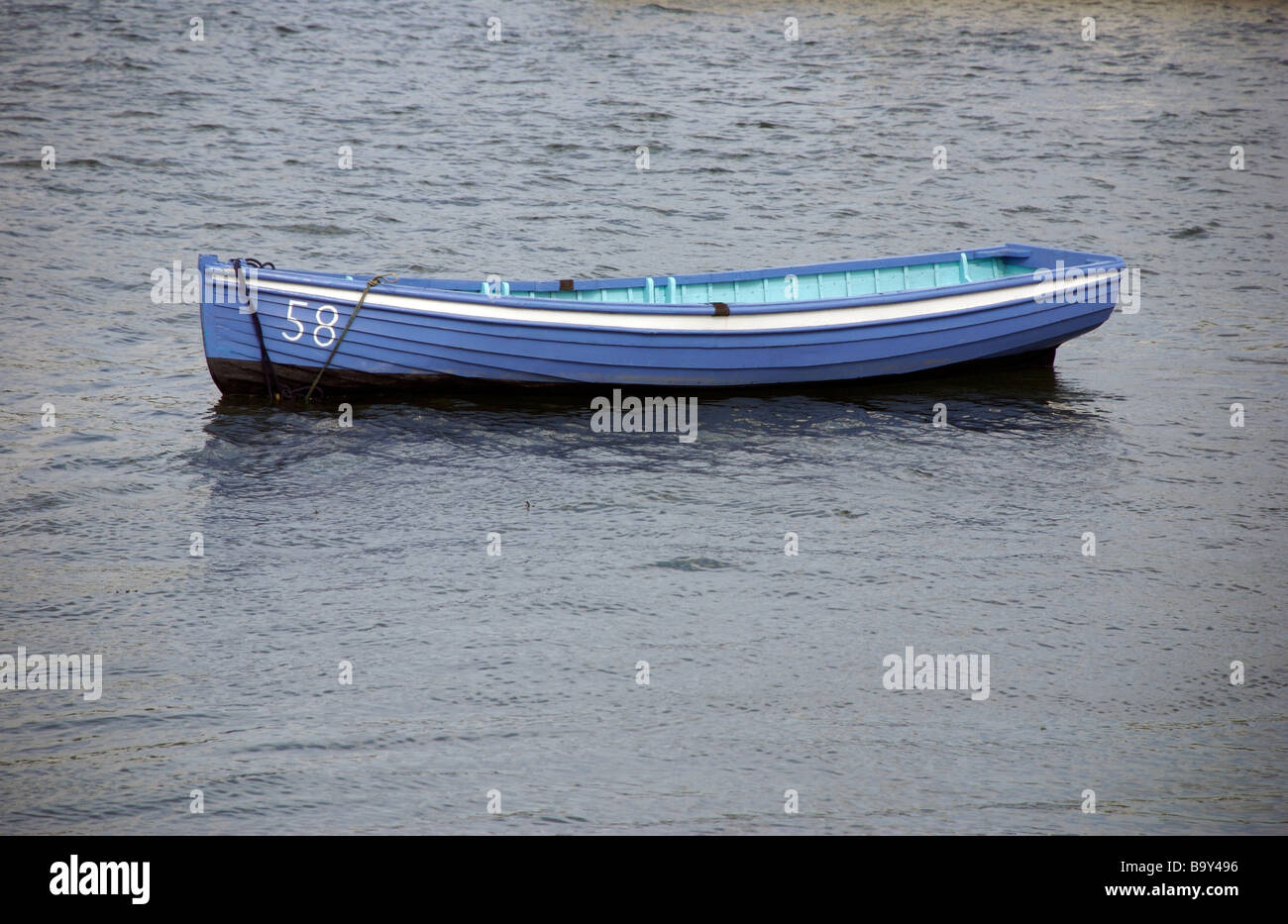 Number 58 pastel blue rowing boat, Saltash, Cornwall, UK Stock Photo