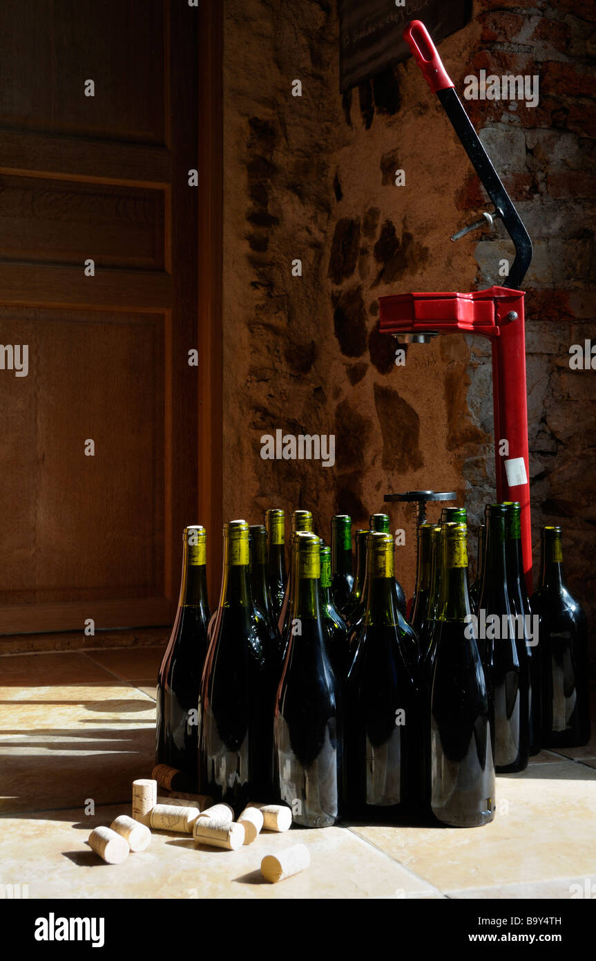 Stock photo of a floor standing wine corking machine standing next to