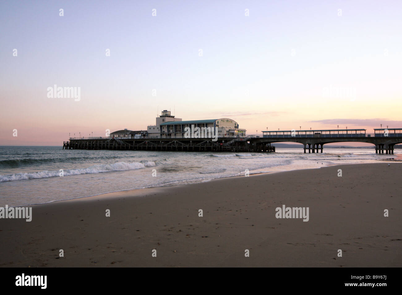 Bournemouth Pier at sunset from the beach Stock Photo