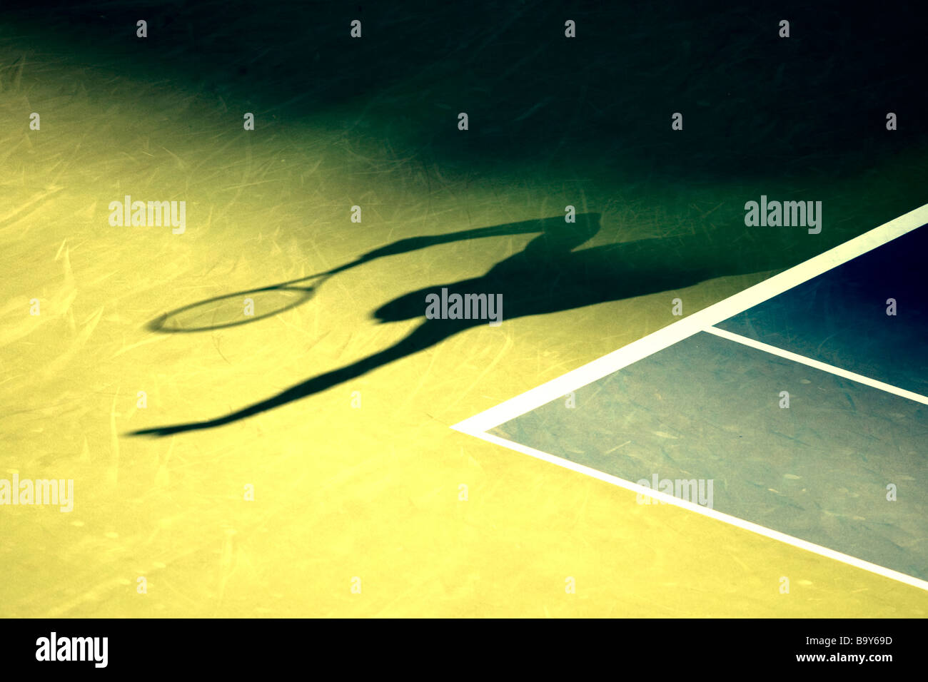 Shadow of tennis player serving Stock Photo Alamy