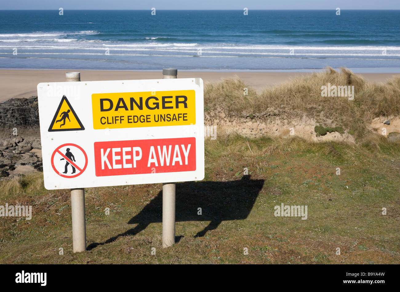 Danger cliff edge unsafe keep away sign along the Cornish coast. Stock Photo