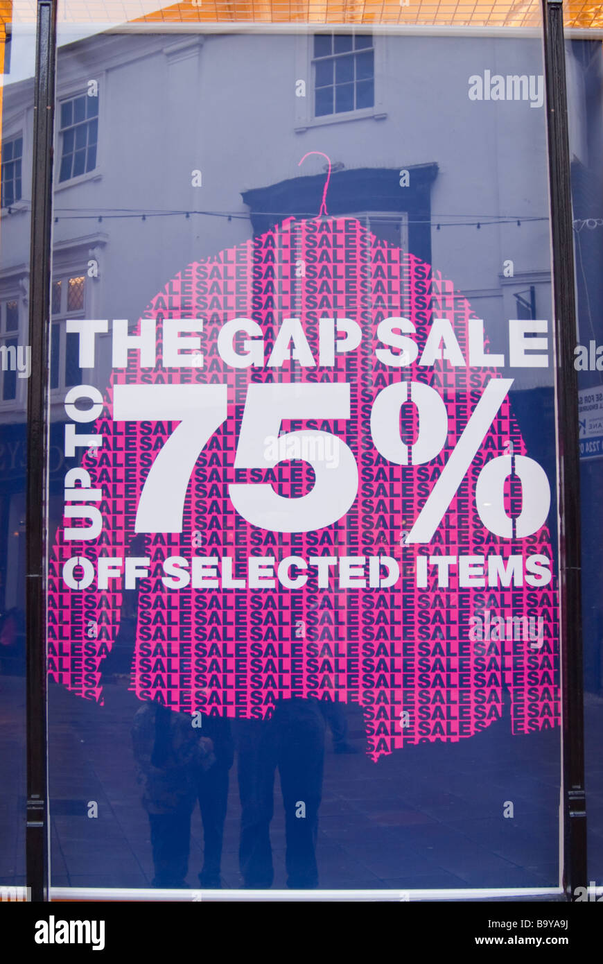 A sign in a shop store window advertising the Gap sale Stock Photo - Alamy