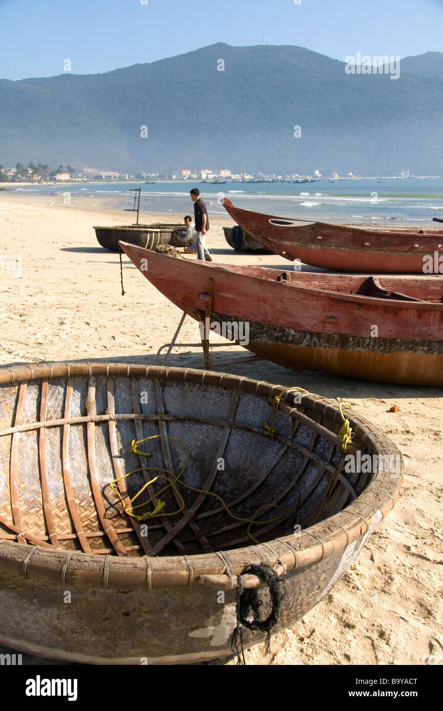 Woven boats and baskets on China Beach near the port city of Da Nang Vietnam Stock Photo