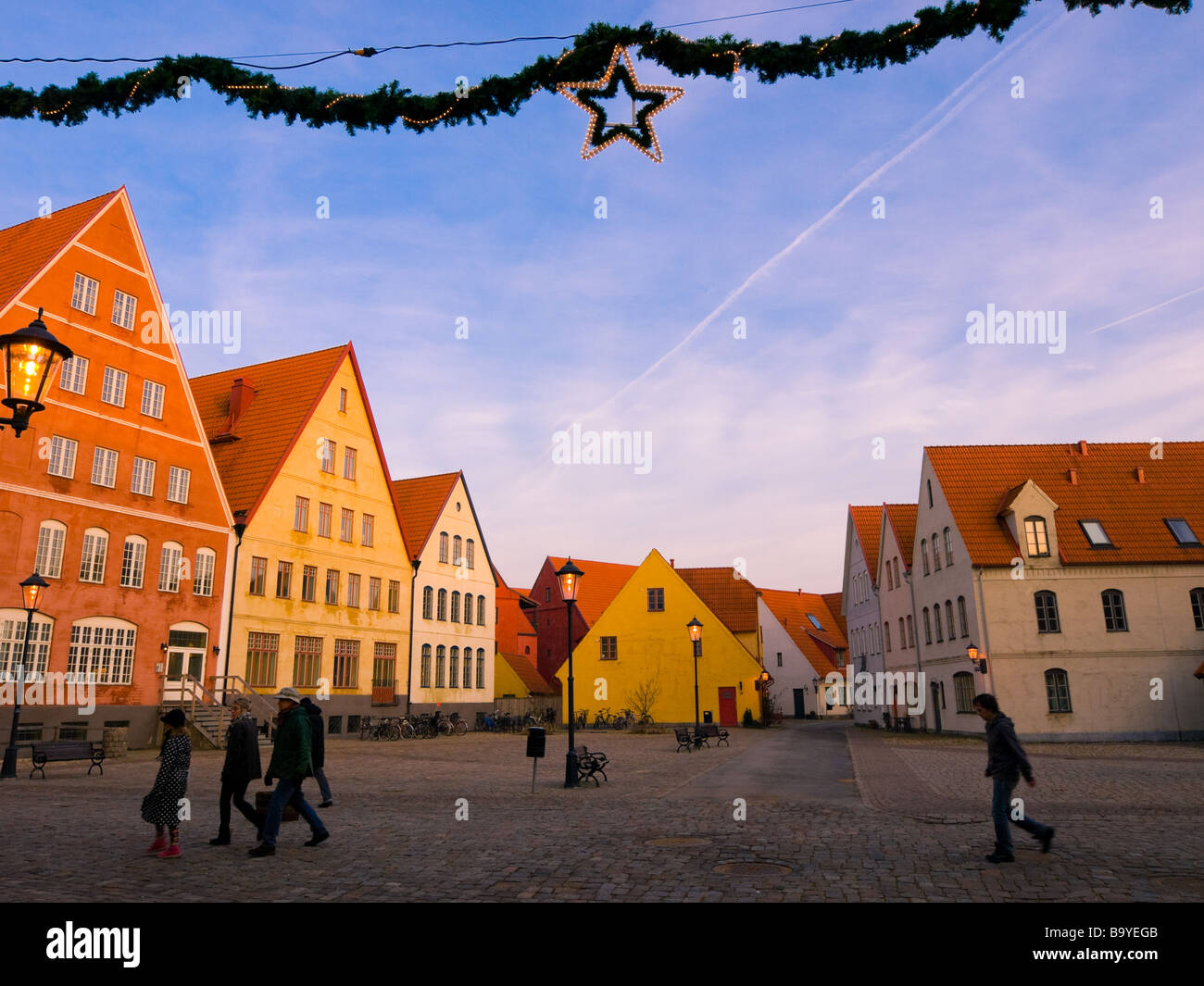 People walking in the Jakriborg district of Hjärup, Sweden during Christmas season. Stock Photo